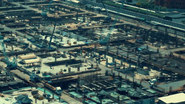 Large Construction Site with Heavy Construction Machinery in Metropolis alt