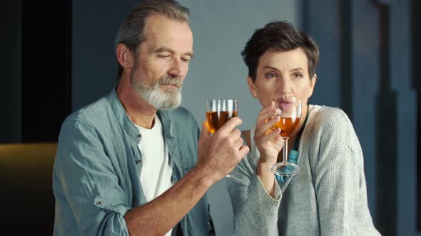 Aged Couple Drinking Wine