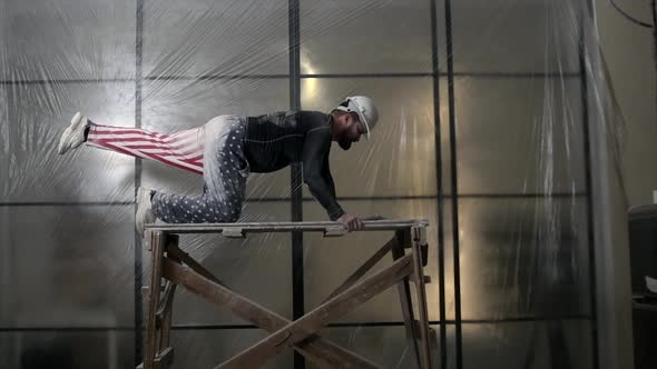 Happy American Builder in Hardhat is Dancing