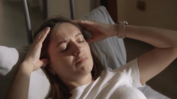 Woman Suffering From Headache