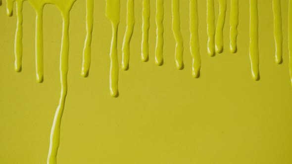 Yellow Paint Background Color Tint Drops on Wall Closeup