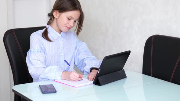 Young Girl Learn By Tablet at Home