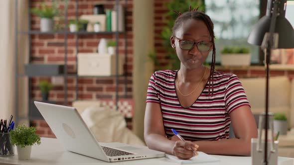 Portrait of Freelancer Taking Notes at Remote Business Job