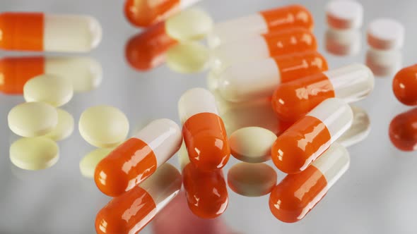 Assorted Pills on Black Table