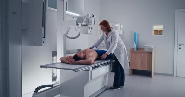 Female Doctor Doing Chest X Ray Scan of Male Patient