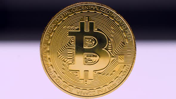 Golden Bitcoin on White Background