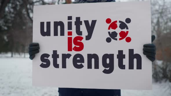 Unity Is Strength Slogan On Banner At Demonstration For Human Rights And Justice