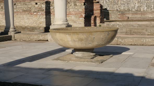 GAMZIGRAD, SERBIA - DECEMBER 25, 2017 Fountain inside Felix Romuliana palace built by Roman Emperor 