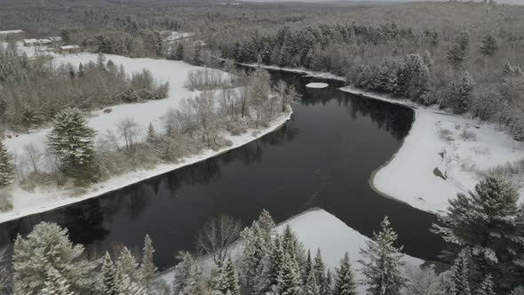 Small village on banks of Piscataquis river. Maine. USA. Aerial view