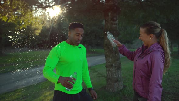 Slow motion shot of runners splashing water, shot on Phantom Flex 4K alt