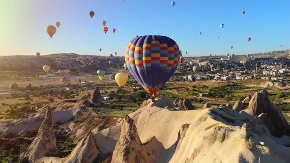 Aerial Hot Air Balloons Flying Over Hoodoos and Fairy Chimneys in Goreme Valley Cappadocia, Turkey