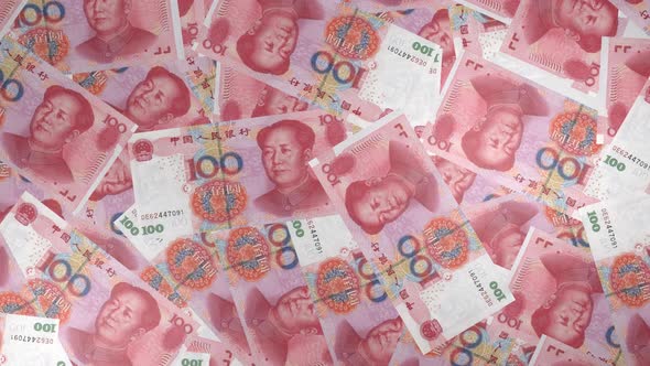 100 Chinese Yuan bills background. Many banknotes.