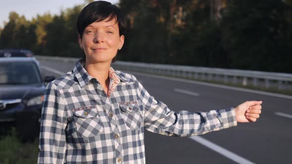 Traveller on the Driveway Try To Get Town Hitch-hiking