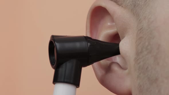 Checking a Human Ear with an Endoscope in Otolaryngology
