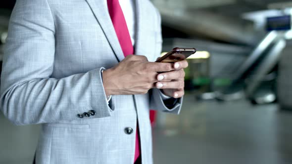 Cropped Shot of Businessman Using Smartphone