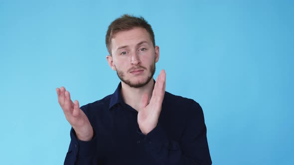 Skeptical Man Unimpressed Expression Clapping Gif