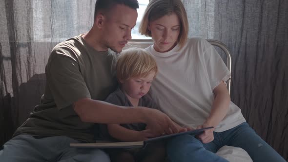 Parents with Small Child in Hospital Ward Watching Book Illustration