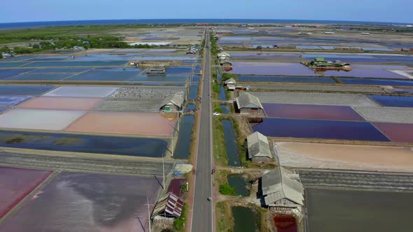 Phetchaburi Salt Flats Naklua Farms and Farmers Collecting Salt in Phetchaburi Thailand