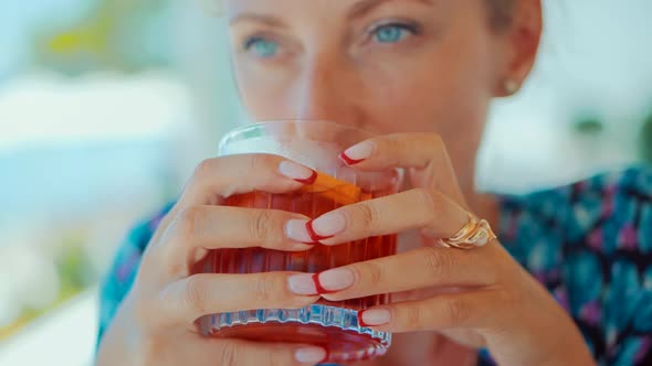 Woman Drinking Alcohol Negroni Cocktail In Bar. Summer Holiday Vacation Travel On Sea.