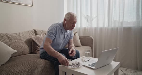 Elderly Man Making Video Call to Doctor