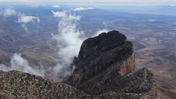 Misty Clouds Boil over Desert Peak