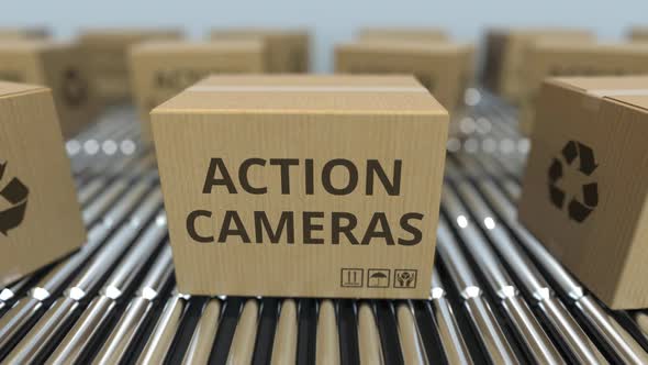 Cartons with Action Cameras on Roller Conveyors