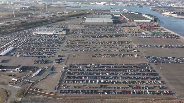 Aerial of a Automotive Car Terminal Parking Lot Storage Loading Area Ready for Distribution in the