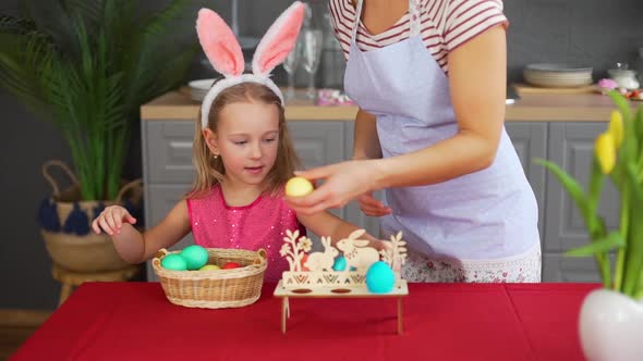 Woman and Little Girl Decorating Easter Table
