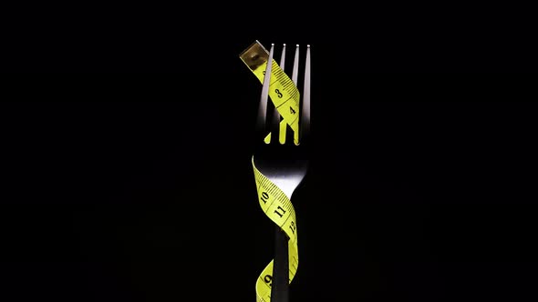 Yellow Measuring Tape on the Fork