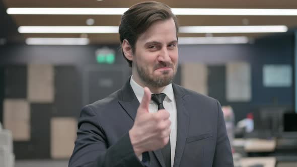 Portrait of Businessman Showing Thumbs Up Sign