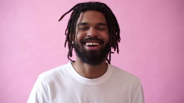 Young Attractive African Man Looking at Camera and Smiling