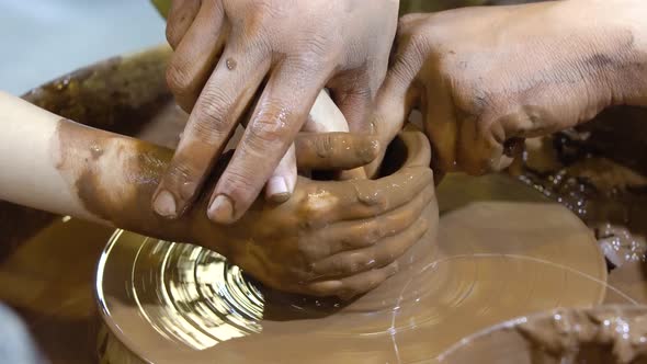 The Potters Wheel and Hands of the Potter.