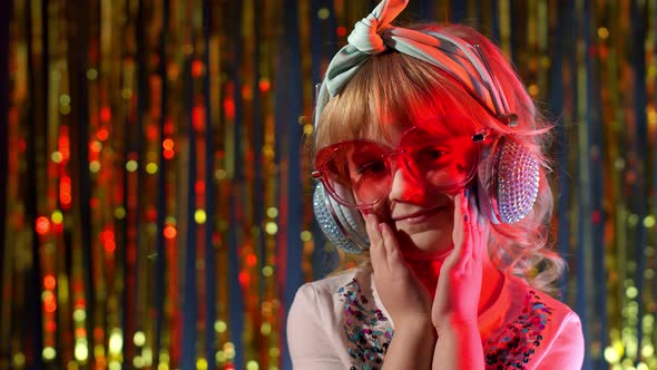 Portrait of Trendy Stylish Girl Looking at Camera Smiling Child Kid in Neon Light at Disco Club