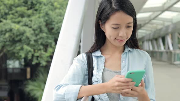 Woman use of mobile phone at outdoor