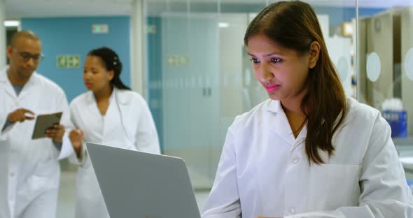 Scientist using laptop in office 4k