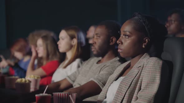 Africal Couple Enjoying Date in Cinema.