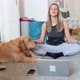 Golden retriever assisting woman meditating in front of laptop, Milan, Italy - VideoHive Item for Sale