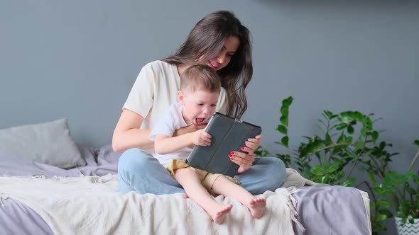 Mother and Son with Tablet at Home