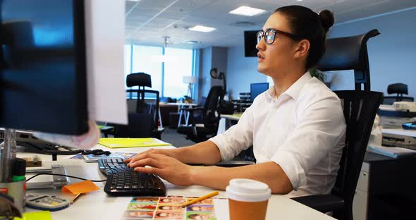 Male graphic designer working at desk