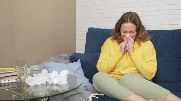 Woman Sneezes and Blows Her Nose in Handkerchief She Has Cold Flu Pandemic Infection