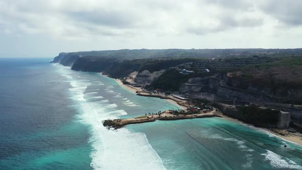 Wide angle overhead copy space shot of a sunshine white sandy paradise beach and aqua blue ocean bac