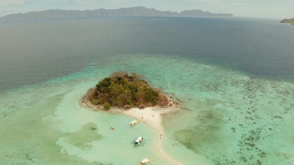 Small Torpic Island with a White Sandy Beach Top View