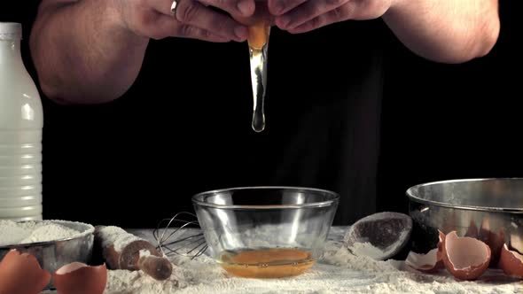 Super Slow Motion Hands Cooks Break the Egg for Baking