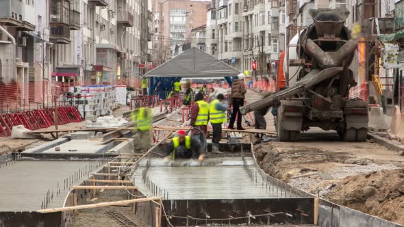 Concrete Works for Road Maintenance Construction with Many Workers and Mixer Timelapse