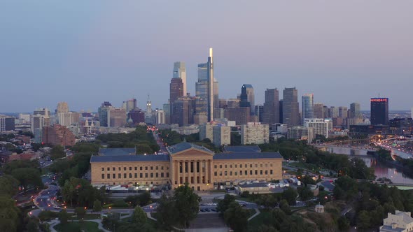 Aerial drone push in view of the downtown Philadelphia skyline featuring tall, glass skyscrapers at