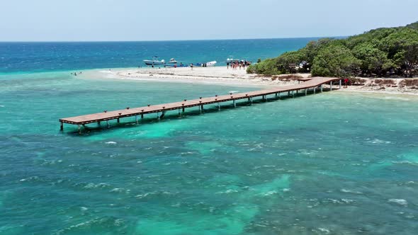 Tourists At Isla Cabra With Jetty During Summer In Montecristi, Dominican Republic. - aerial