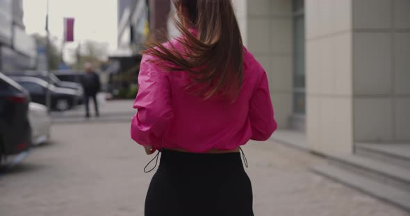 Back View Unrecognizable Sporty Woman Jogging in the City