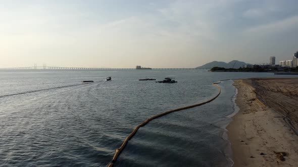 Fish boat move near reclamation land