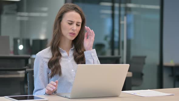 Young Businesswoman with Headache Working on Laptop