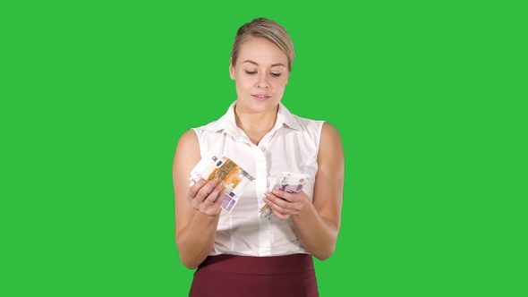 Businesswoman with money counting them on a Green Screen